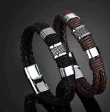 Two braided leather bracelets with metal clasps on a dark background