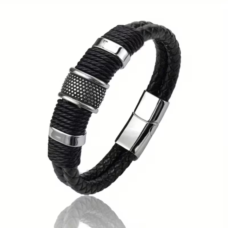 Black braided leather bracelet with silver metal accents on a white background