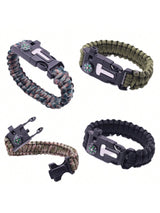 Four paracord survival bracelets with black quick-release buckles and compasses, shown in different colorways on a white background.