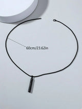 Black necklace with a pendant on a white background, showing measurement text.