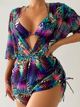 Multicolored tropical print swimsuit on a plain background