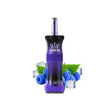 A purple and black Crown Bar 140ml glass bottle with a clear straw, surrounded by blueberries, green leaves, and ice cubes on a white background.
