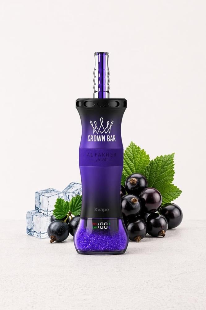 A purple and black Xvape disposable vape device with a metallic purple mouthpiece, styled on a light gray surface with blackcurrants, mint leaves, and ice cubes. The brand 'CROWN BAR' is clearly visible on the front of the device.