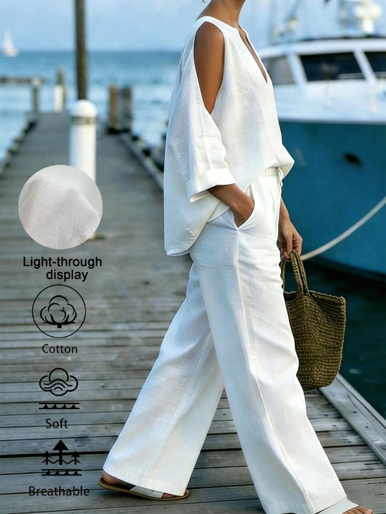 Person wearing a white outfit on a dock with a boat in the background