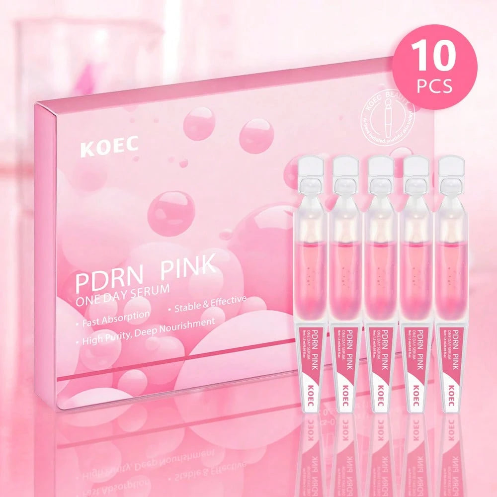 Korean skincare product set with ampoules and packaging on a pink background