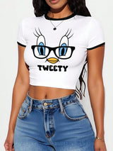 Person wearing a crop top with Tweety bird design and text.