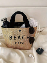 Woven bag with 'BEACH PLEASE' text on a white surface