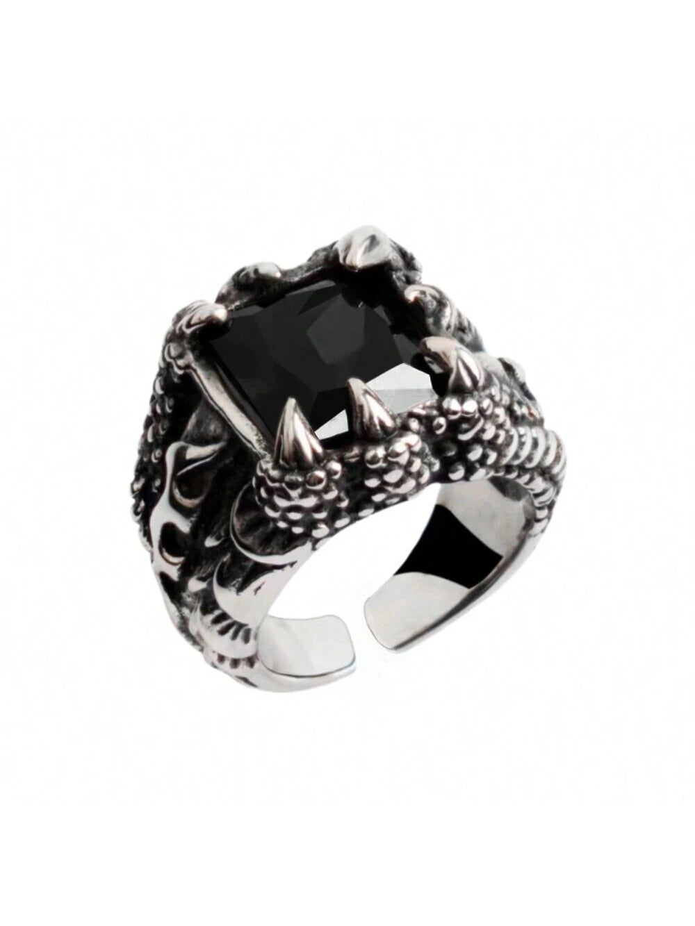 Silver ring with dragon design and black gemstone on a white background