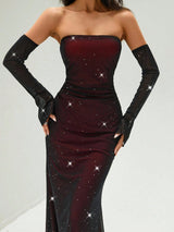 Woman wearing a strapless burgundy dress with star patterns and black gloves on a light gray background