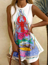 Woman wearing a sleeveless dress with a colorful lobster and fish design.