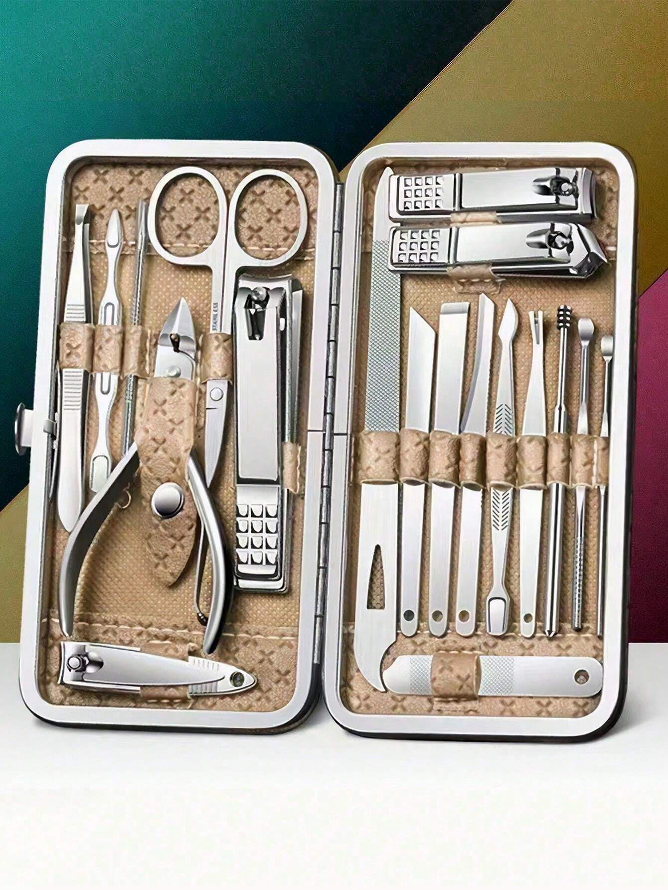 Manicure and pedicure set with tools in a beige case on a white background