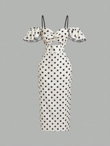 A white off-the-shoulder midi dress with black polka dots, featuring ruffled sleeves, thin shoulder straps, and a sweetheart neckline, shown against a solid gray background.