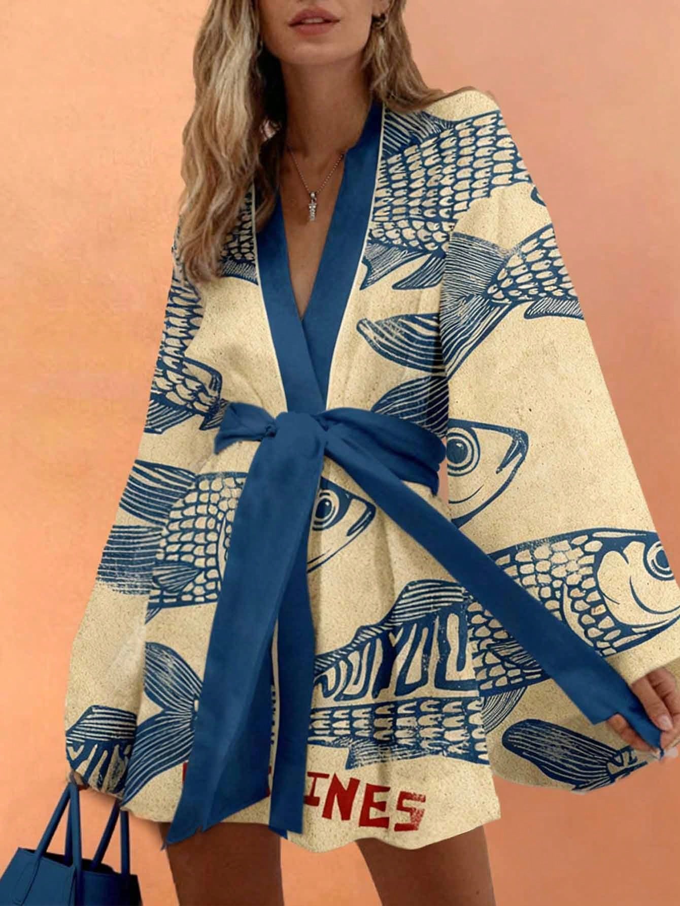 Woman wearing a fish-patterned kimono with a blue ribbon against an orange background