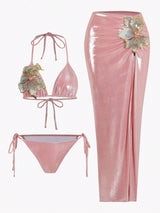 Pink bikini set with matching skirt on a white background