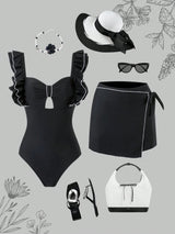 Black swimsuit with ruffles, black skirt, white bag, sunglasses, and hat on a gray background with floral patterns.
