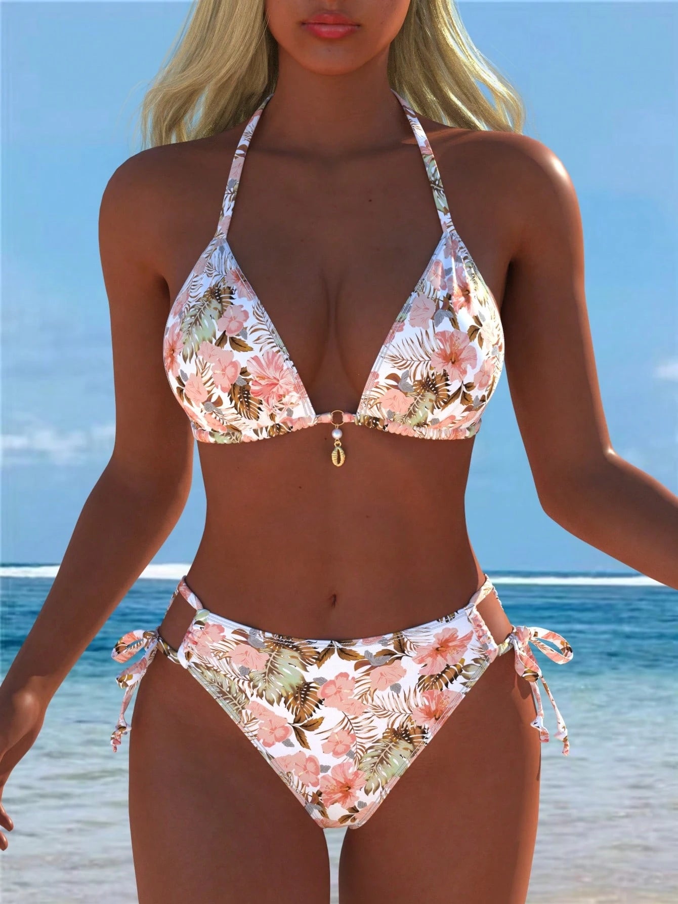 A woman modeling a two-piece halter bikini with a pink, green, and brown tropical floral print on a white background, set against a sunny beach backdrop with blue ocean and sky.